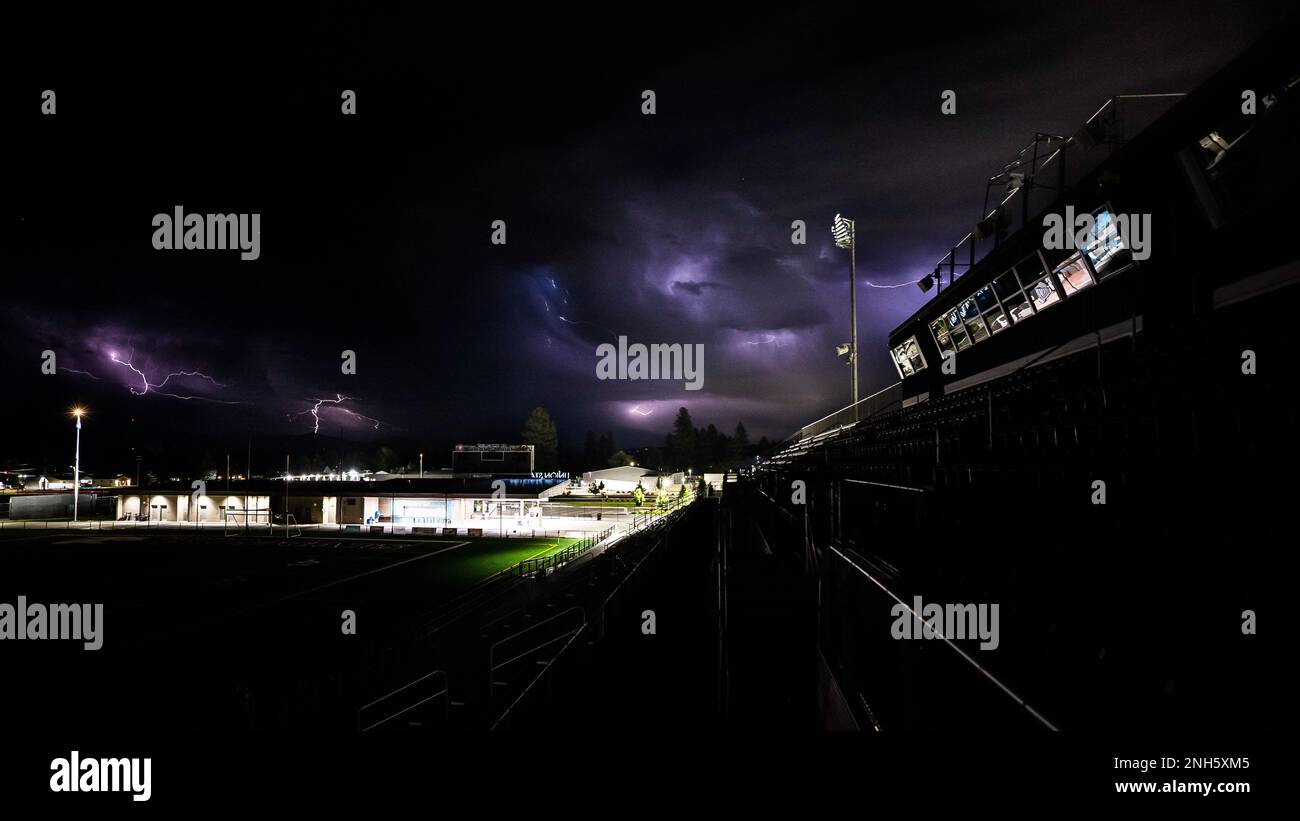 Multiple lightning strikes appear in the clouds over Union Stadium in