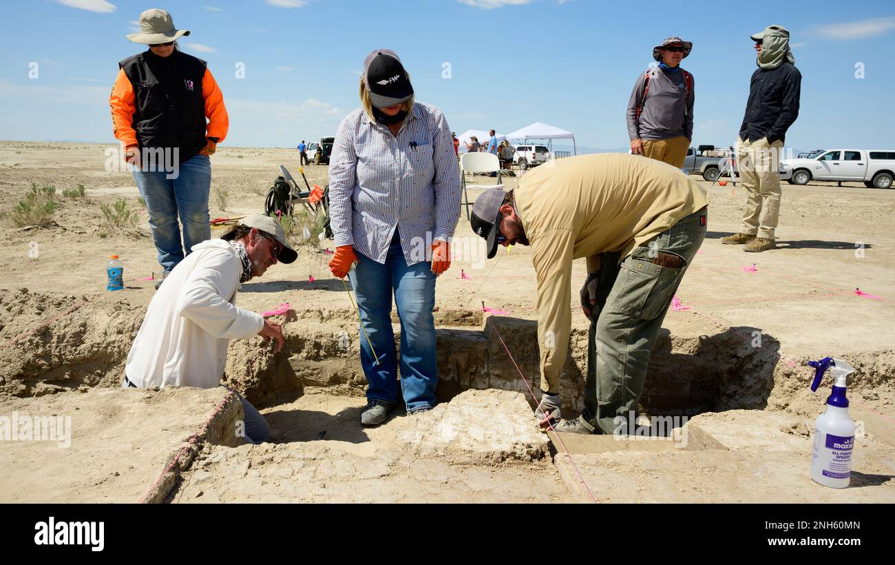 Left to right, D. Craig Young, Joanna Robertson, and Lucas Johnson, Far Western Anthropological Research Group, work an archaeological site on the Utah Test and Training Range July 18, 2022. In compliance with Section 106 of the National Historic Preservation Act, the Air Force works closely with the Utah State Historic Preservation Office to explore, discover, and preserve historical and cultural artifacts on the UTTR. Stock Photo