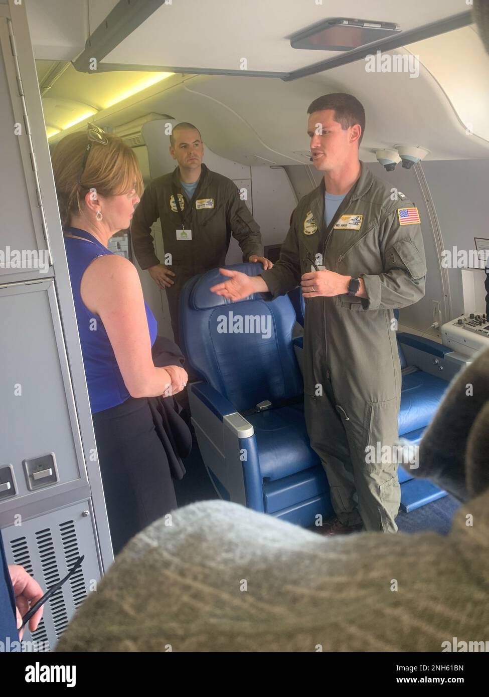 Lt. Nick Arnold and Petty Officer 1st Class Gary Wheaton with Deputy Undersecretary of the Air Force for International Affairs Ms. Kelli Seybolt aboard the P-8A Stock Photo