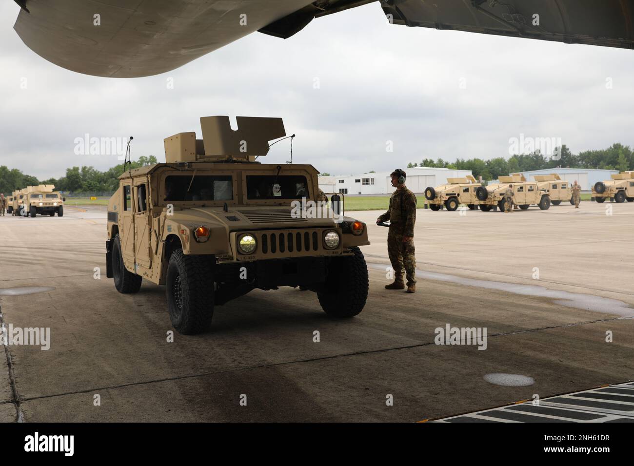 U.S. Army Soldiers of the 412th Civil Affairs Battalion, 360th Civil Affairs Brigade, are loading High Mobility Multipurpose Wheeled Vehicle HMMWV)) inside of the C-5 Galaxy departing from John Glenn Columbus International Airport on July 18, 2022. Operation Viking is an intense joint task force exercise designed to prepare Soldiers with realistic training simulating deployment of civil affairs units in direct support of a contingency operation in Africa. Stock Photo