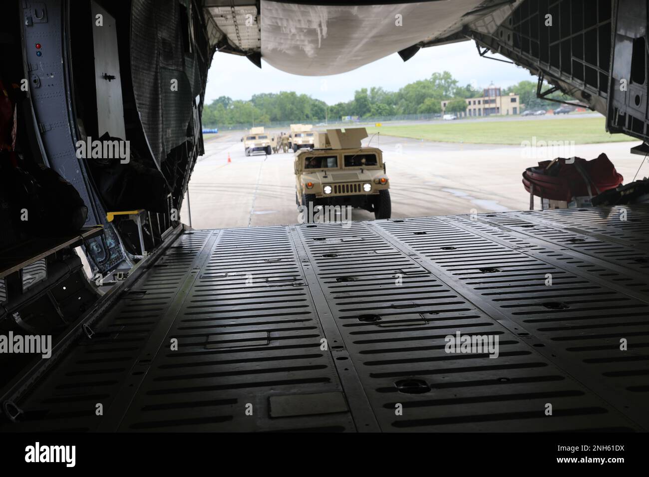 U.S. Army Soldiers of the 412th Civil Affairs Battalion, 360th Civil Affairs Brigade, are loading High Mobility Multipurpose Wheeled Vehicle HMMWV)) inside of the C-5 Galaxy departing from John Glenn Columbus International Airport on July 18, 2022. Operation Viking is an intense joint task force exercise designed to prepare Soldiers with realistic training simulating deployment of civil affairs units in direct support of a contingency operation in Africa. Stock Photo