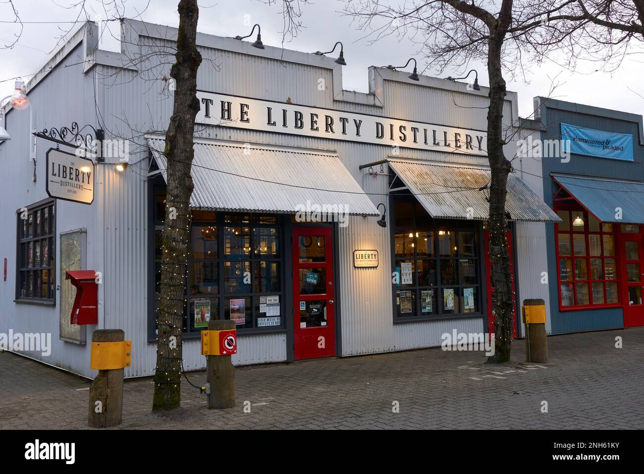 The Liberty Distillery on Granville Island at dusk, Vancouver, British Columbia, Canada Stock Photo