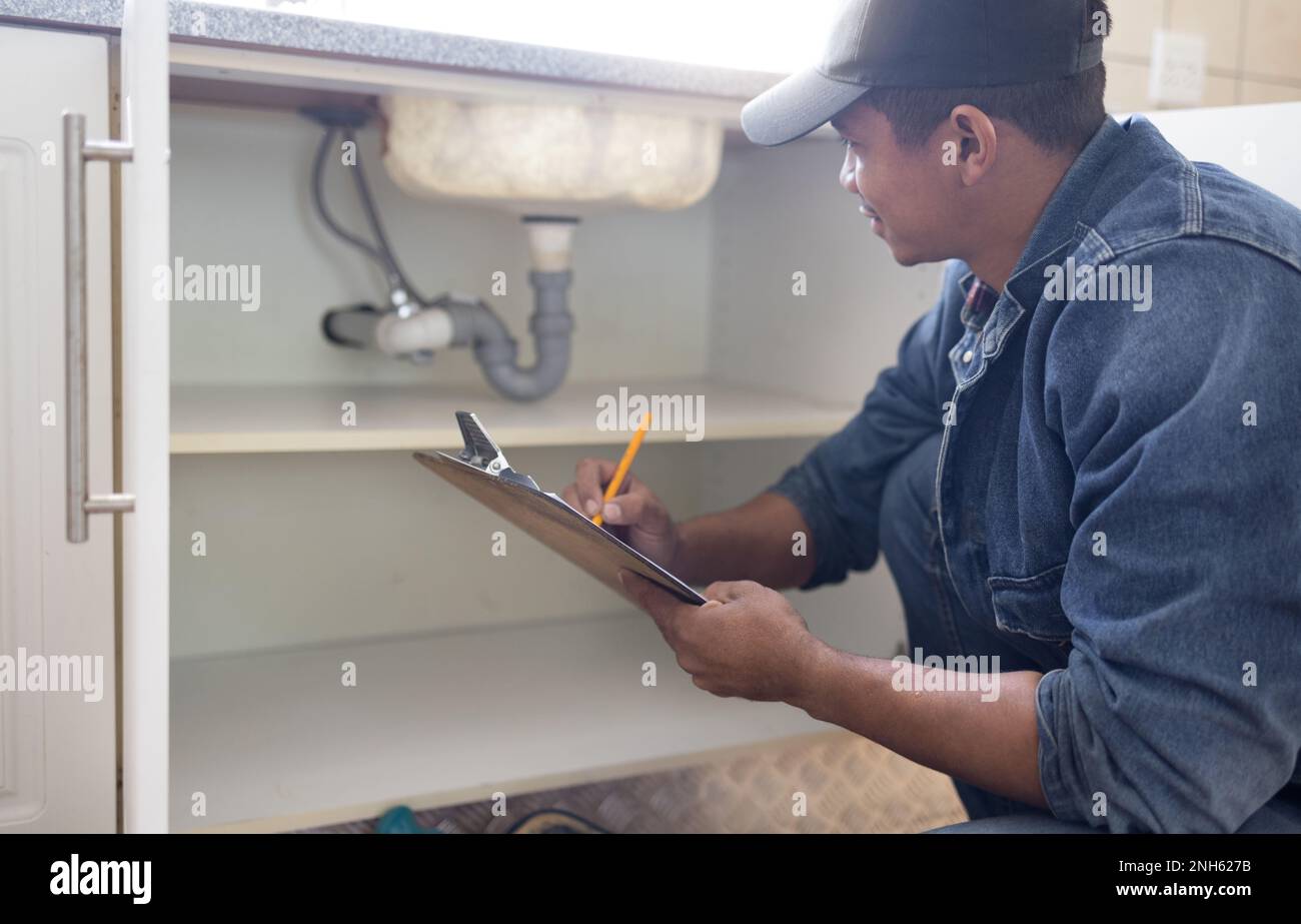 Plumber, sink maintenance document and plumbing check of a handyman in