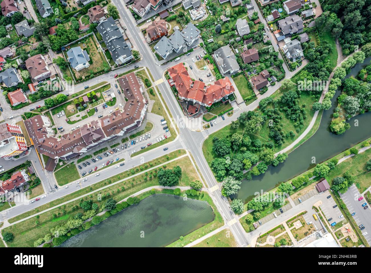 aerial top view of urban residential district along river in summer day Stock Photo