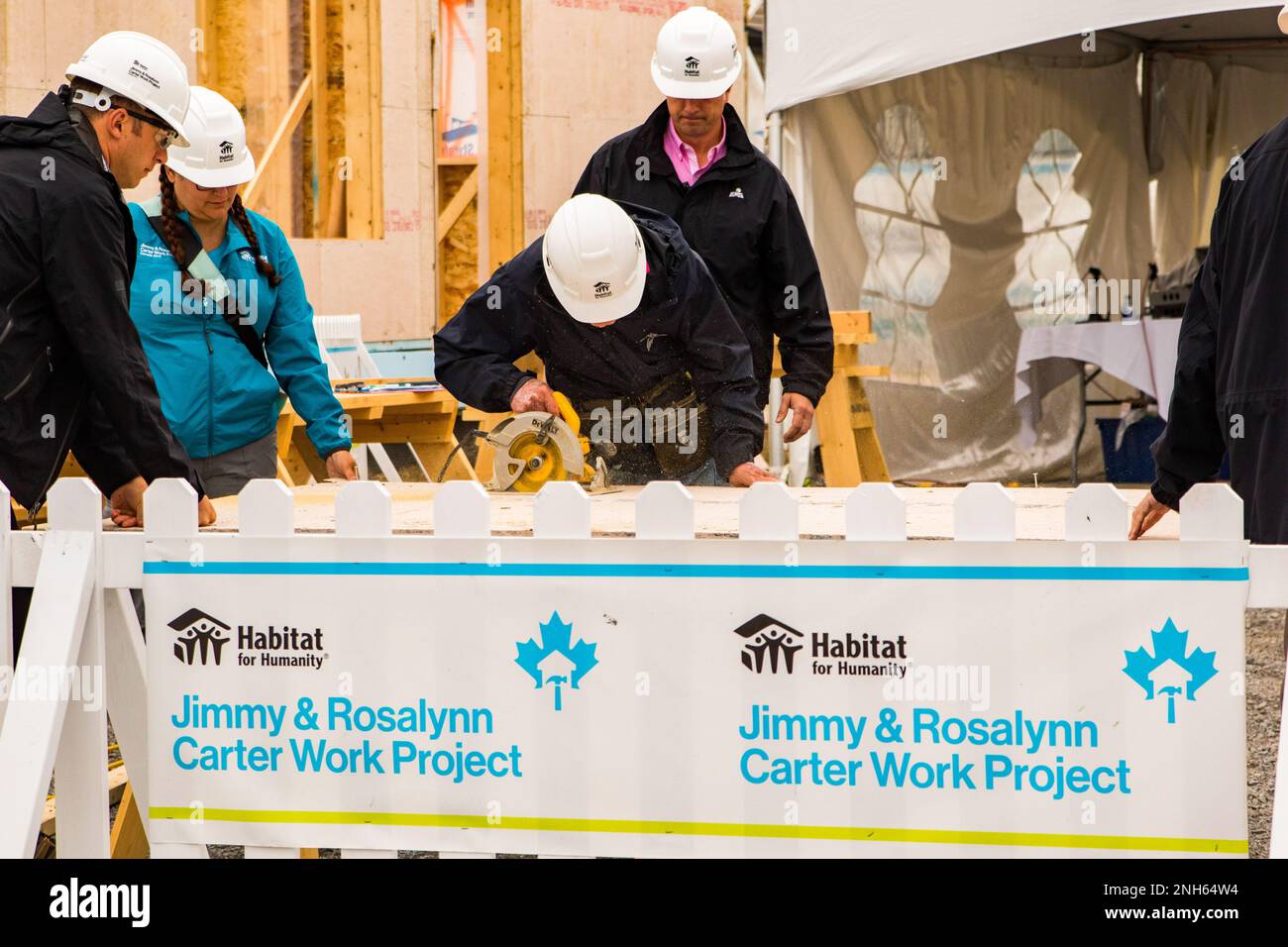 93 year old President Jimmy Carter puts his saw skills to use at the