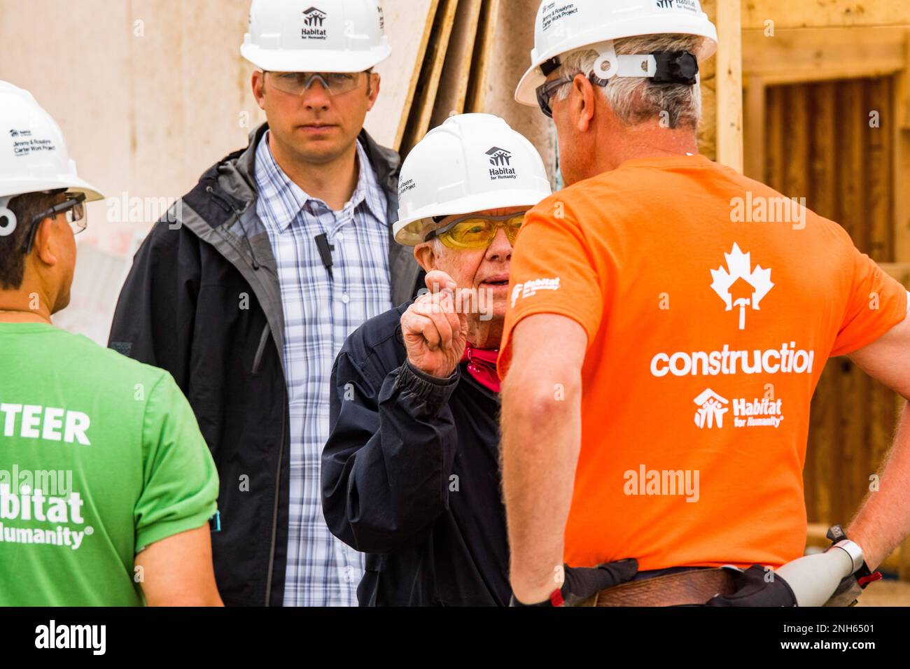 93 year old President Jimmy Carter discusses the project with one of