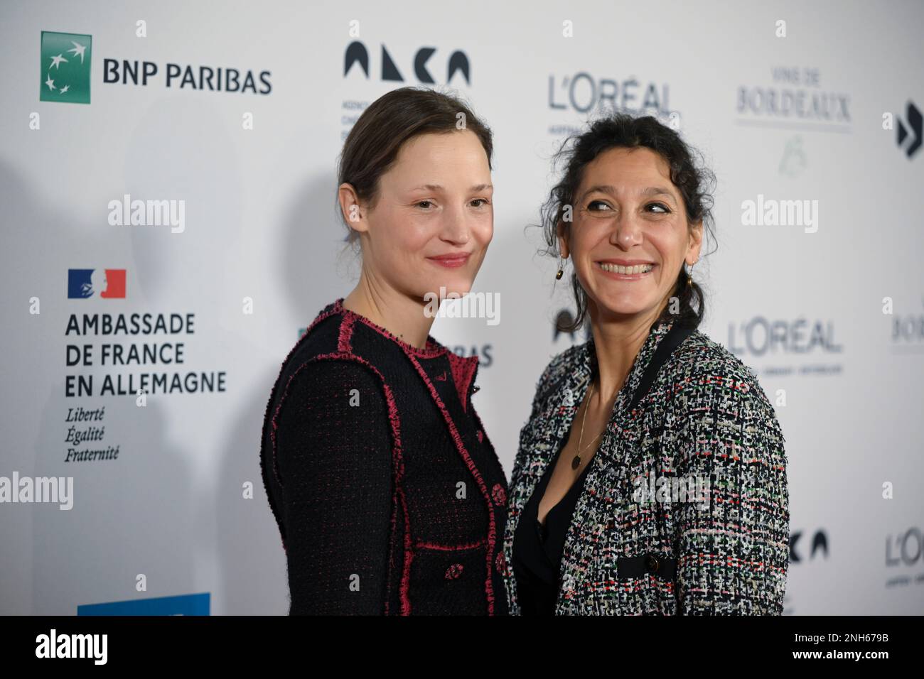 Berlin, Germany. 20th Feb, 2023. Actress Vicky Krieps (l) and director Emily Atef arrive at the Soiree francaise du cinema event at the French Embassy. Vicky Krieps was awarded the 'Ordre des Arts et des Lettres'. Credit: Jens Kalaene/dpa/Alamy Live News Stock Photo