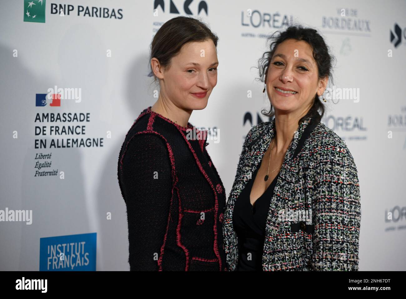 Berlin, Germany. 20th Feb, 2023. Actress Vicky Krieps (l) and director Emily Atef arrive at the Soiree francaise du cinema event at the French Embassy. Vicky Krieps was awarded the 'Ordre des Arts et des Lettres'. Credit: Jens Kalaene/dpa/Alamy Live News Stock Photo
