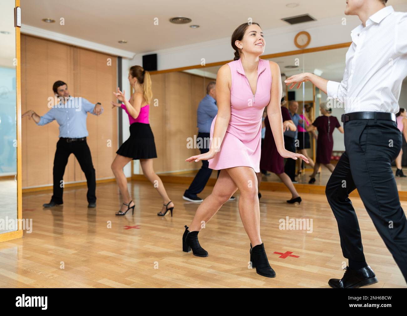 Young pair practicing Latino dance in dance studio Stock Photo