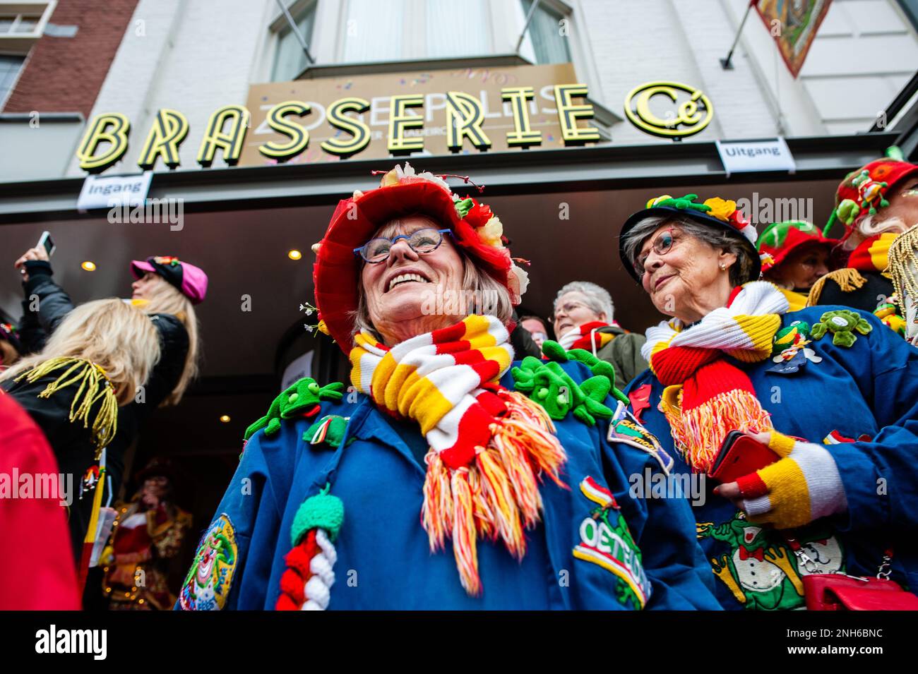 Den Bosch, Netherlands. 20th Feb, 2023. People wearing the official  Oeteldonk traditional costume, blue farmer's smock full of emblems, white  mittens, and a hand-knitted scarf, red-white-yellow are enjoying the  Carnival days celebrated
