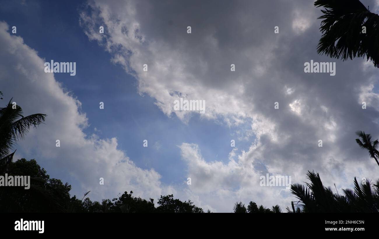 Natural Landscape Of White Clouds And Blue Sky With Silhouettes Of ...