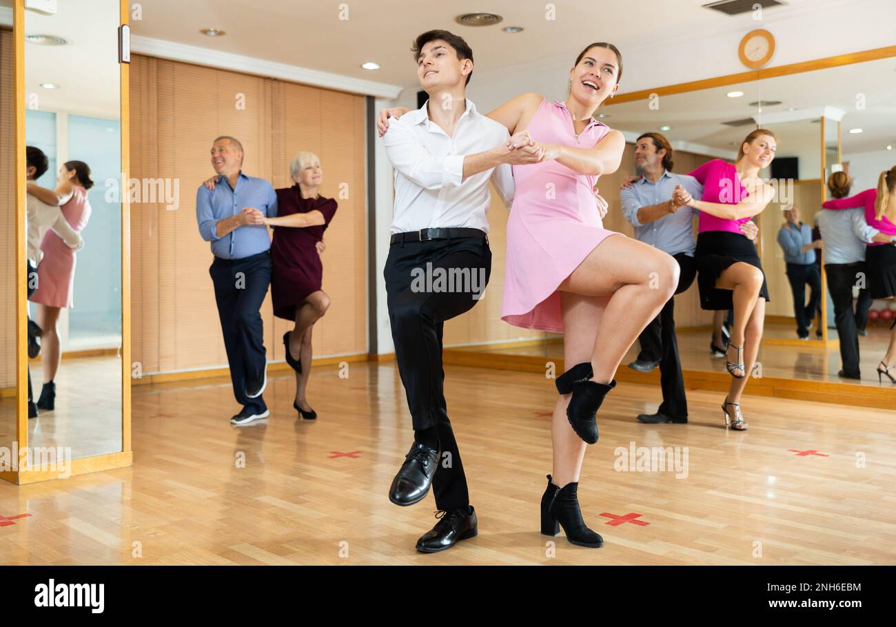 Young pair practicing Latino dance in dance studio Stock Photo