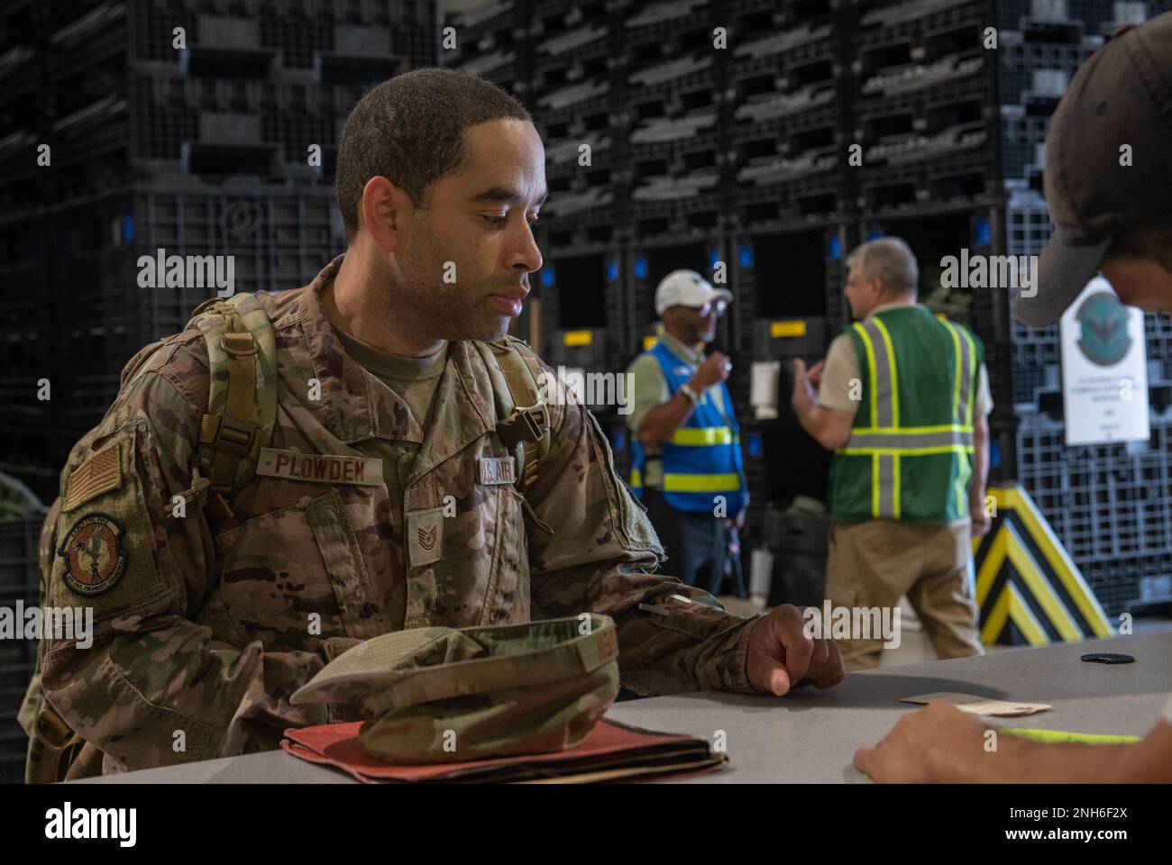 U.S. Air Force Technical Sgt. Dawayne Plowden, 375th Civil Engineering Squadron, waits in the Personnel Deployment Functional line on Scott Air Force Base, Illinois, July 20, 2022. Plowden was chosen to participate in a deployment rehearsal with the goal of being ready to execute rapid global mobility. Stock Photo