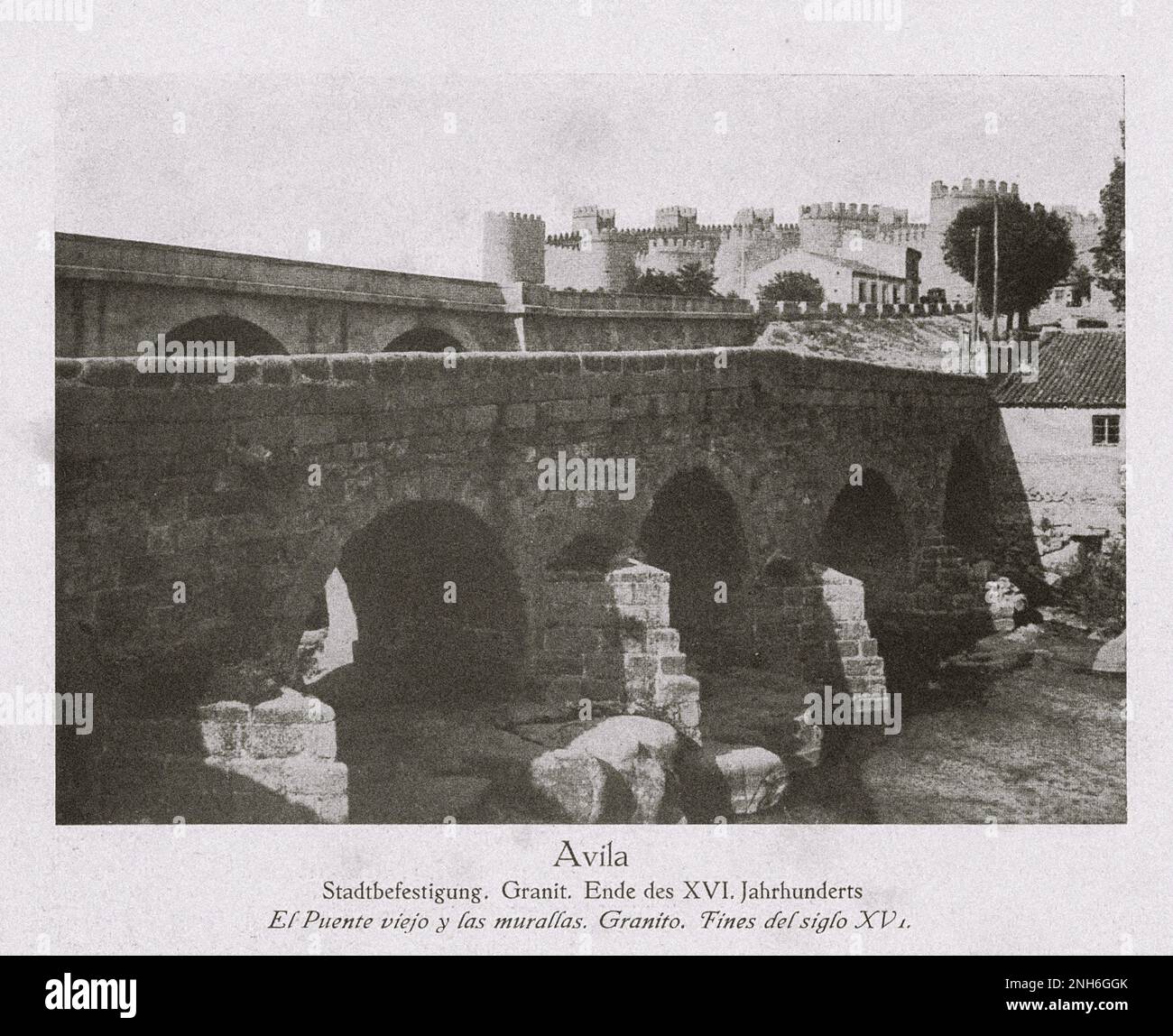 Architecture of Old Spain. Vintage photo of Avila. Fortification. Granite. At the end of the XVI century. Distinctly known by its medieval walls, Ávila is sometimes called the Town of Stones and Saints. It has complete and prominent medieval town walls, built in the Romanesque style. Stock Photo