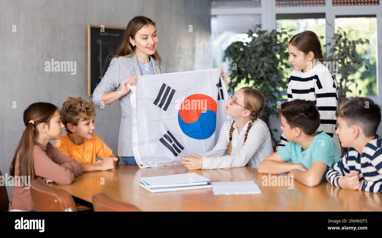 Schoolchildren listen carefully to story about the country South Korea