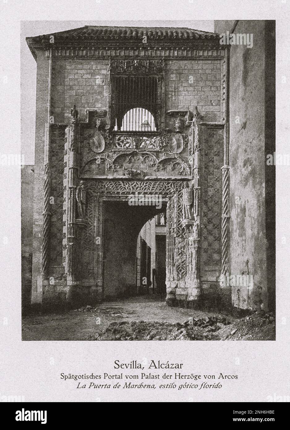 Architecture of Old Spain. Vintage photo of the Royal Alcázars of Seville. Late Gothic portal of the Palace of the Dukes of Arcos. The Royal Alcázars of Seville (Spanish: Reales Alcázares de Sevilla), historically known as al-Qasr al-Muriq and commonly known as the Alcázar of Seville, is a royal palace in Seville, Spain, built for the Christian king Peter of Castile. It was built by Castilian Christians on the site of an Abbadid Muslim alcazar, or residential fortress. Stock Photo