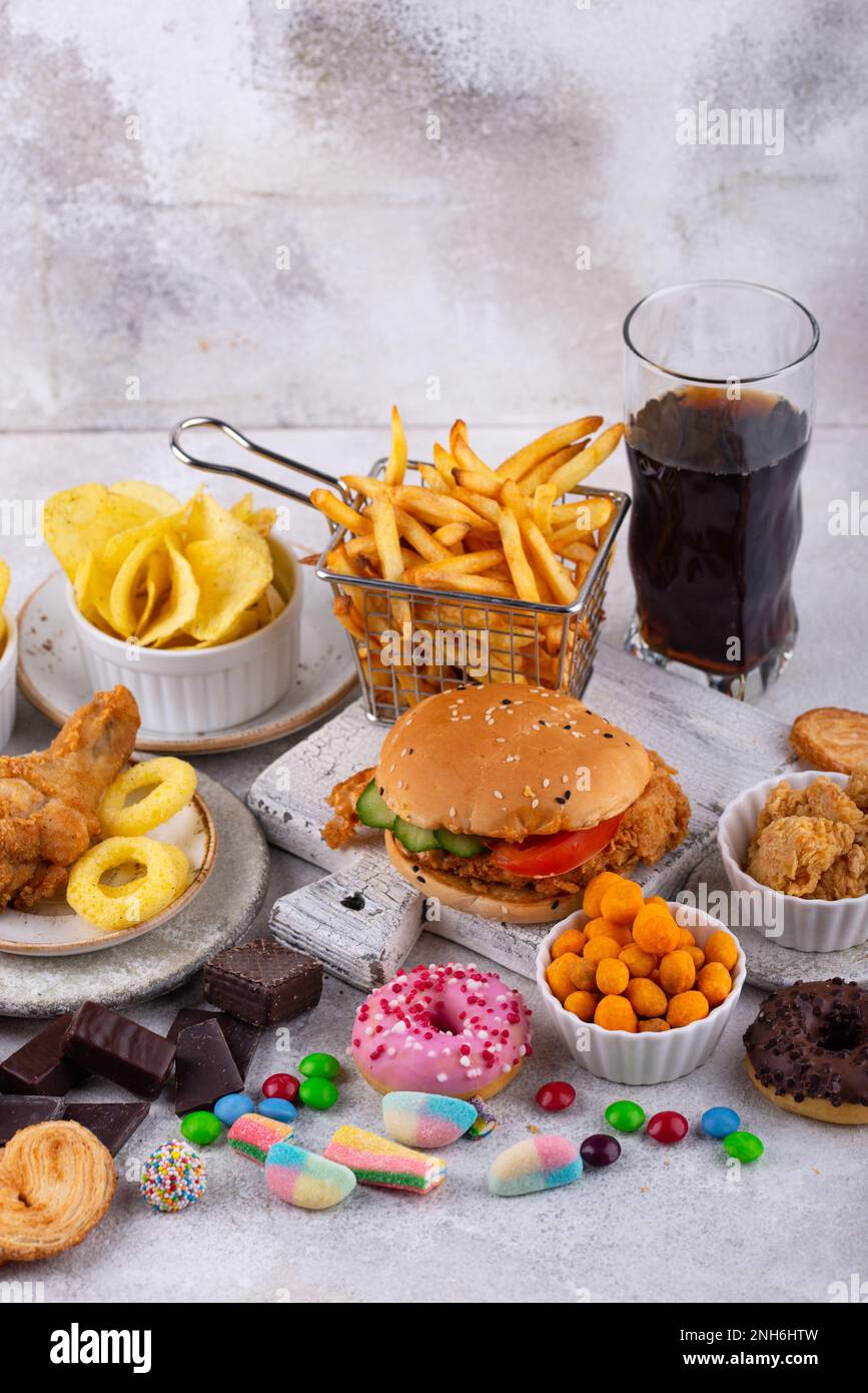 Assortment of various unhealthy junk food Stock Photo - Alamy