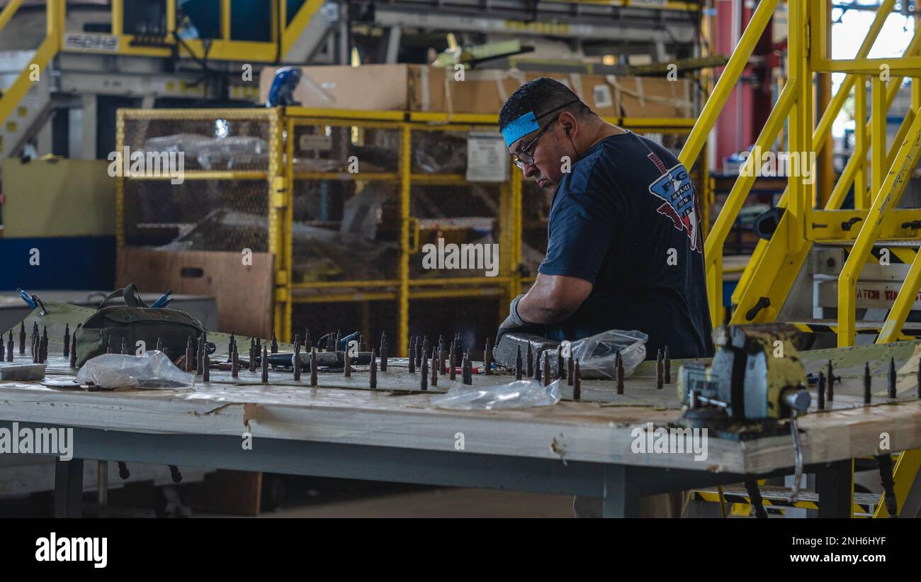 CCAD Artisan performing sheet metal repairs while working the UH60V
