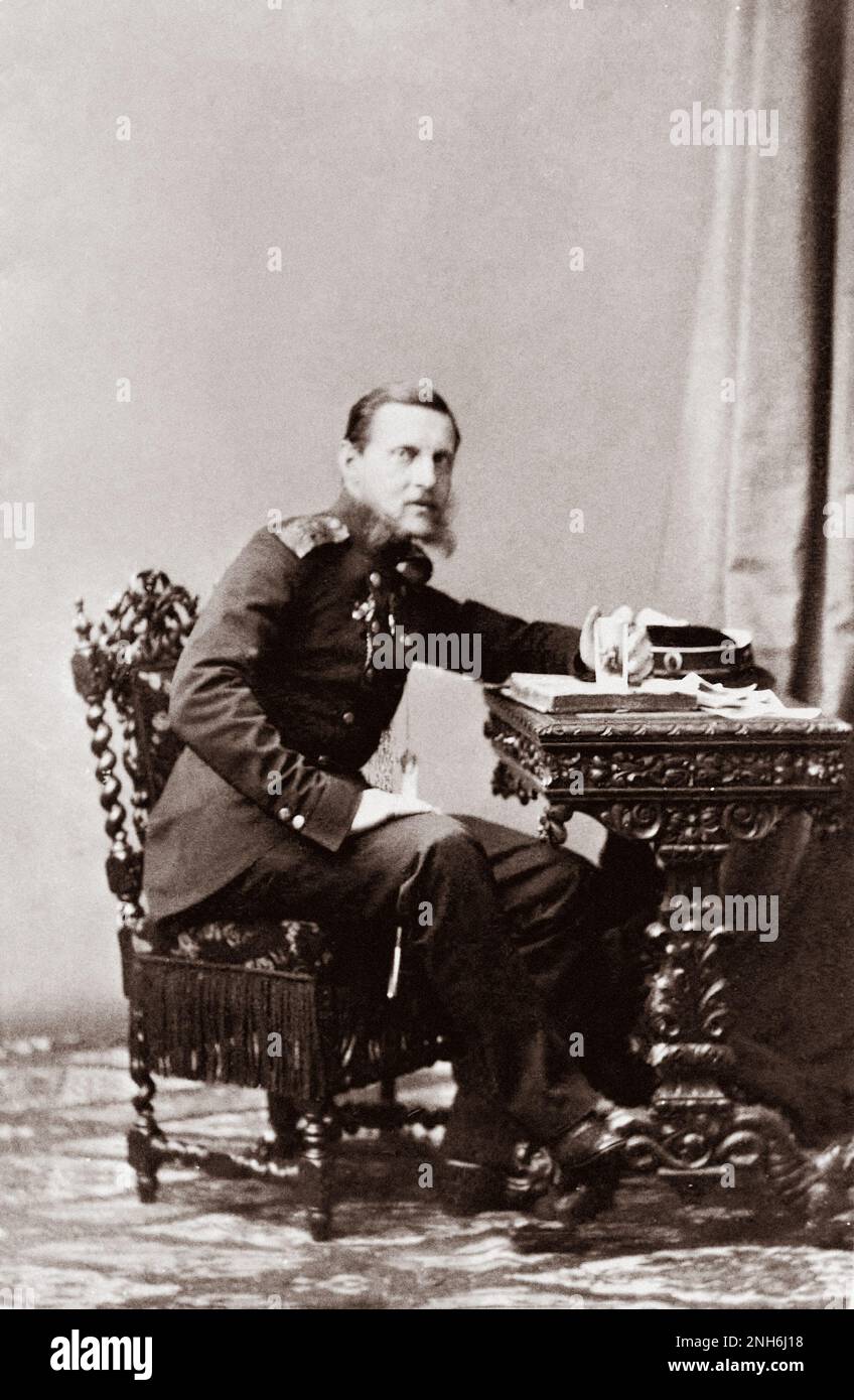 Vintage photo of Grand Duke Konstantin Nikolaevich, Son of Emperor Nicholas I. It shows the grand duke in a semi-profile view, wearing naval uniform sitting at a writing desk. The grand duke was the second son of Emperor Nicholas I (1796--1855) and Empress Alexandra (1798-1860). Trained in naval sciences, languages, mathematics, and navigation by Count Fedor Petrovich Litke (1797-1882), a navigator, geographer, and Arctic explorer, Konstantin was appointed to the State Council in 1850. In 1853 he was promoted to admiral and made head of the naval department. In that capacity he presided over t Stock Photo