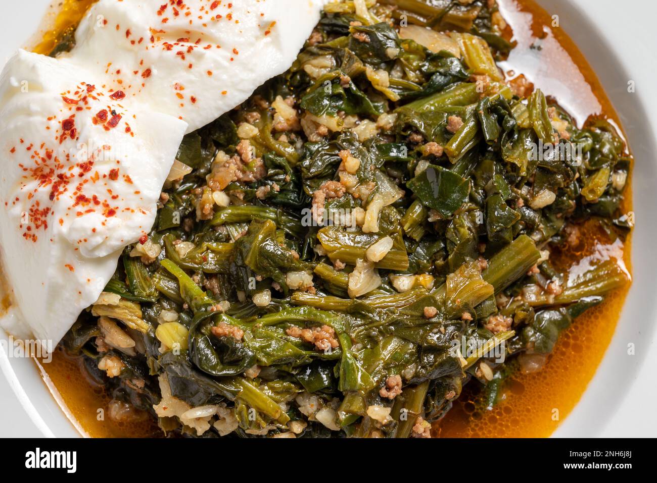 Traditional Turkish spinach meal with rice and minced meat with yogurt