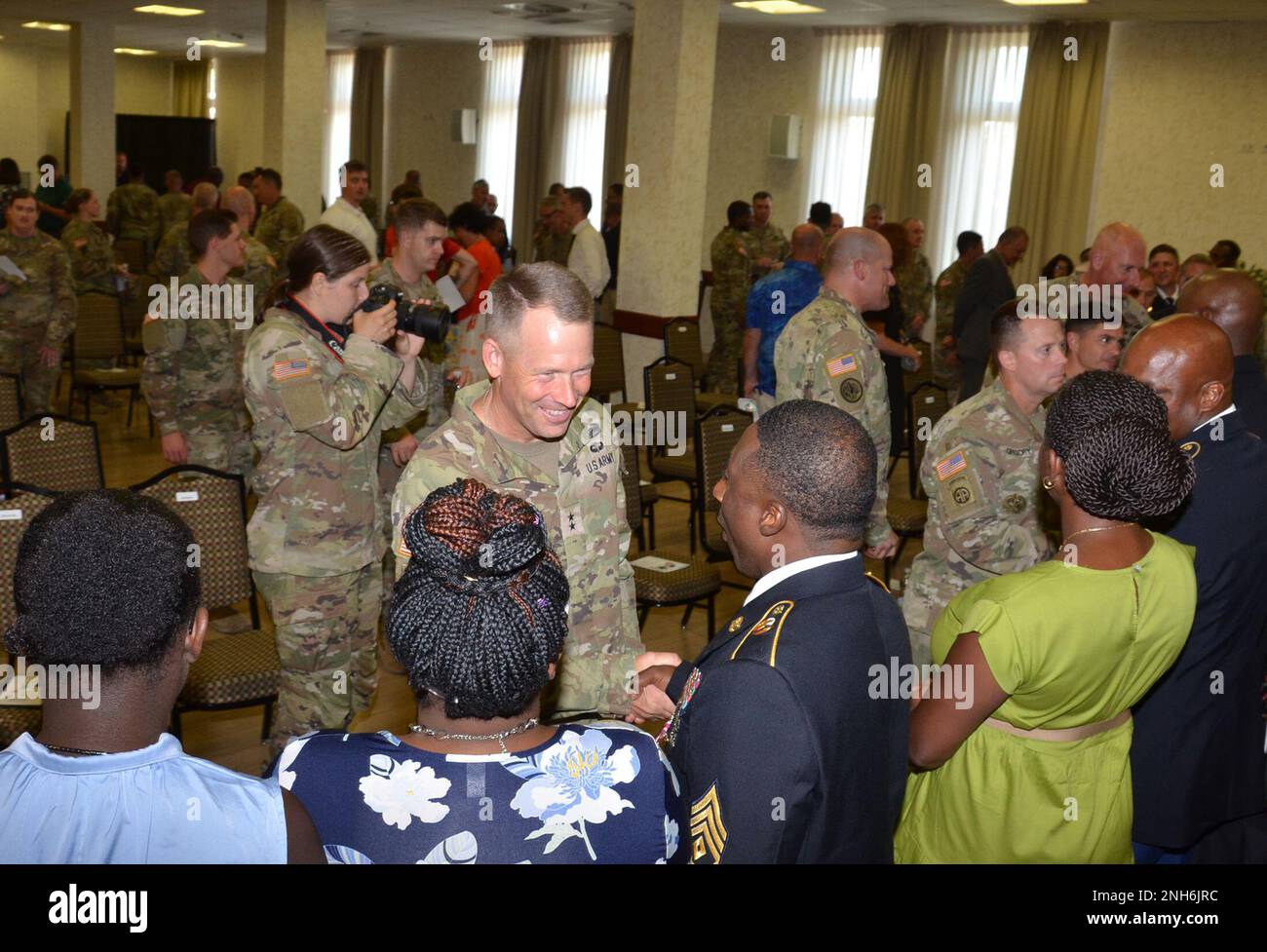 Maj. Gen. Todd R. Wasmund, U.S. Army Southern European Task Force-Africa Commander, congratulates retirees during a July 20 ceremony at Caserma Ederle. Stock Photo