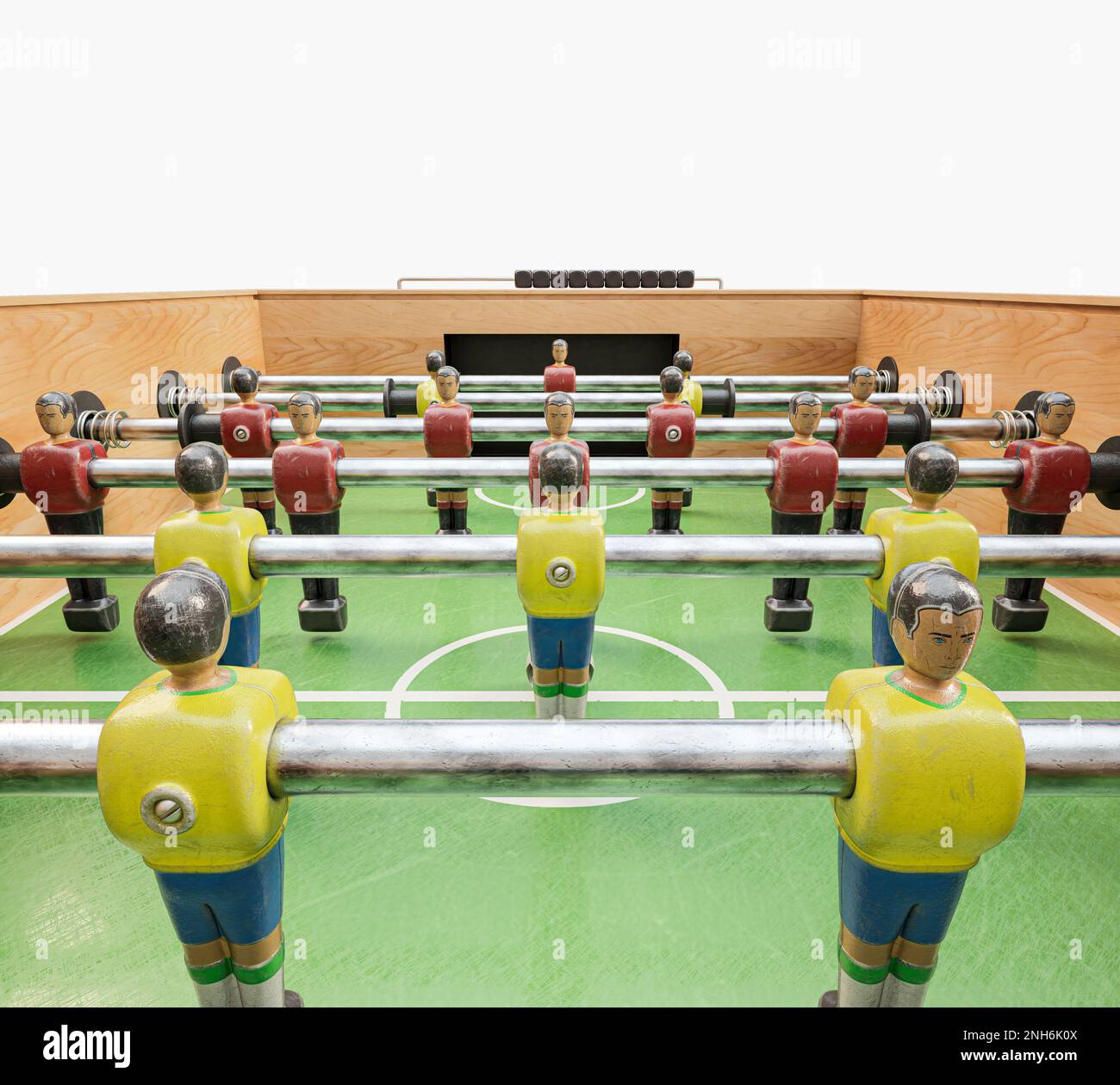 A vintage wooden foosball table with detailed metal player figurines in