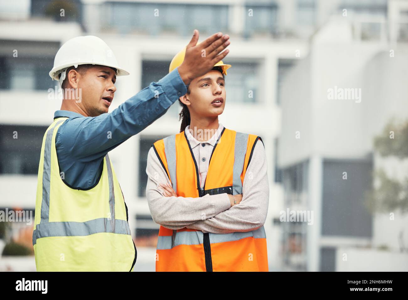 Teamwork, engineering and talking with people on construction site for ...