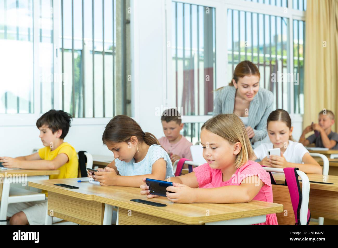 Kids children smartphone cell phones hi-res stock photography and ...