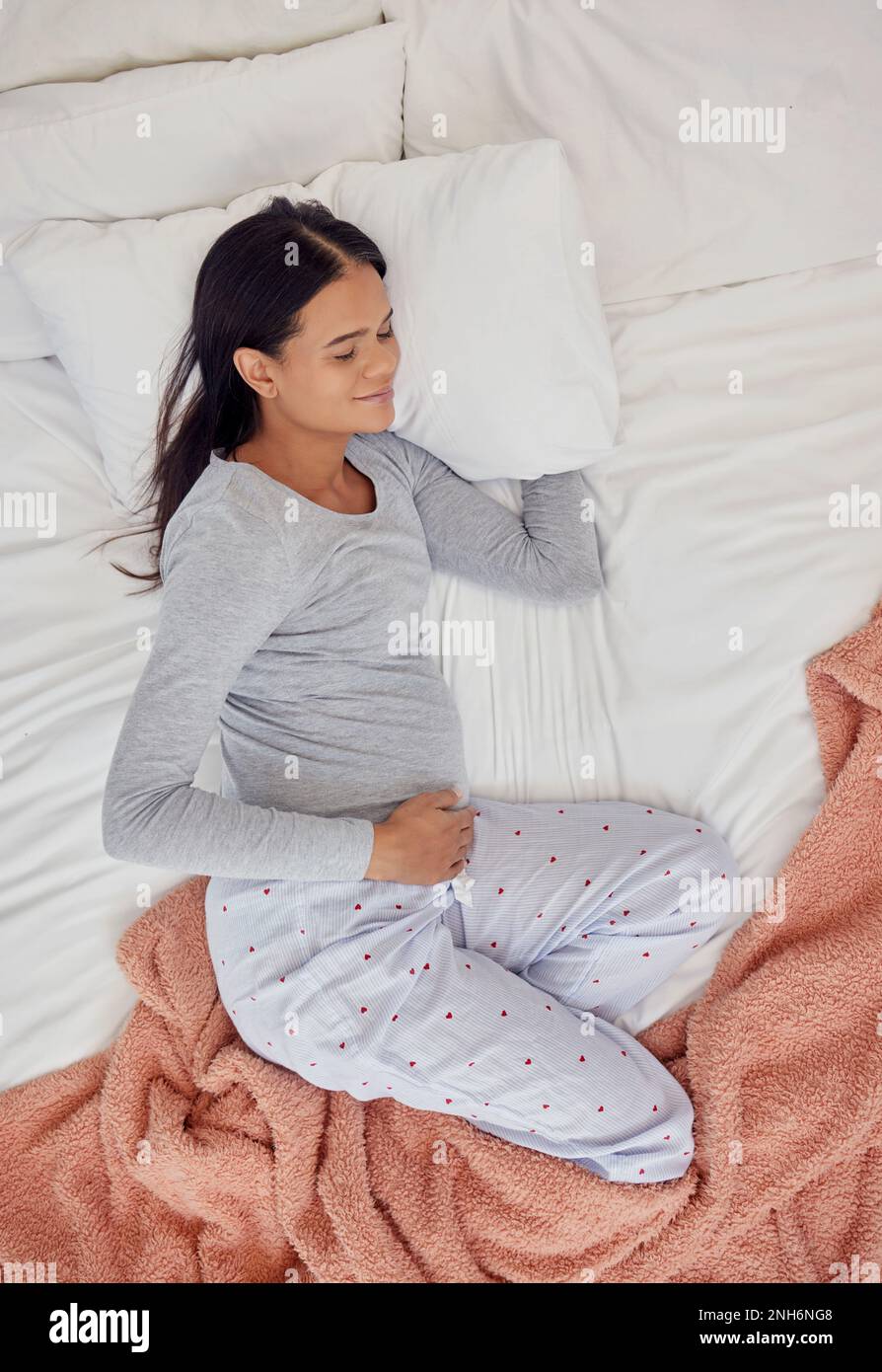 Top view, pregnant and woman sleeping in bedroom for peace, healthy
