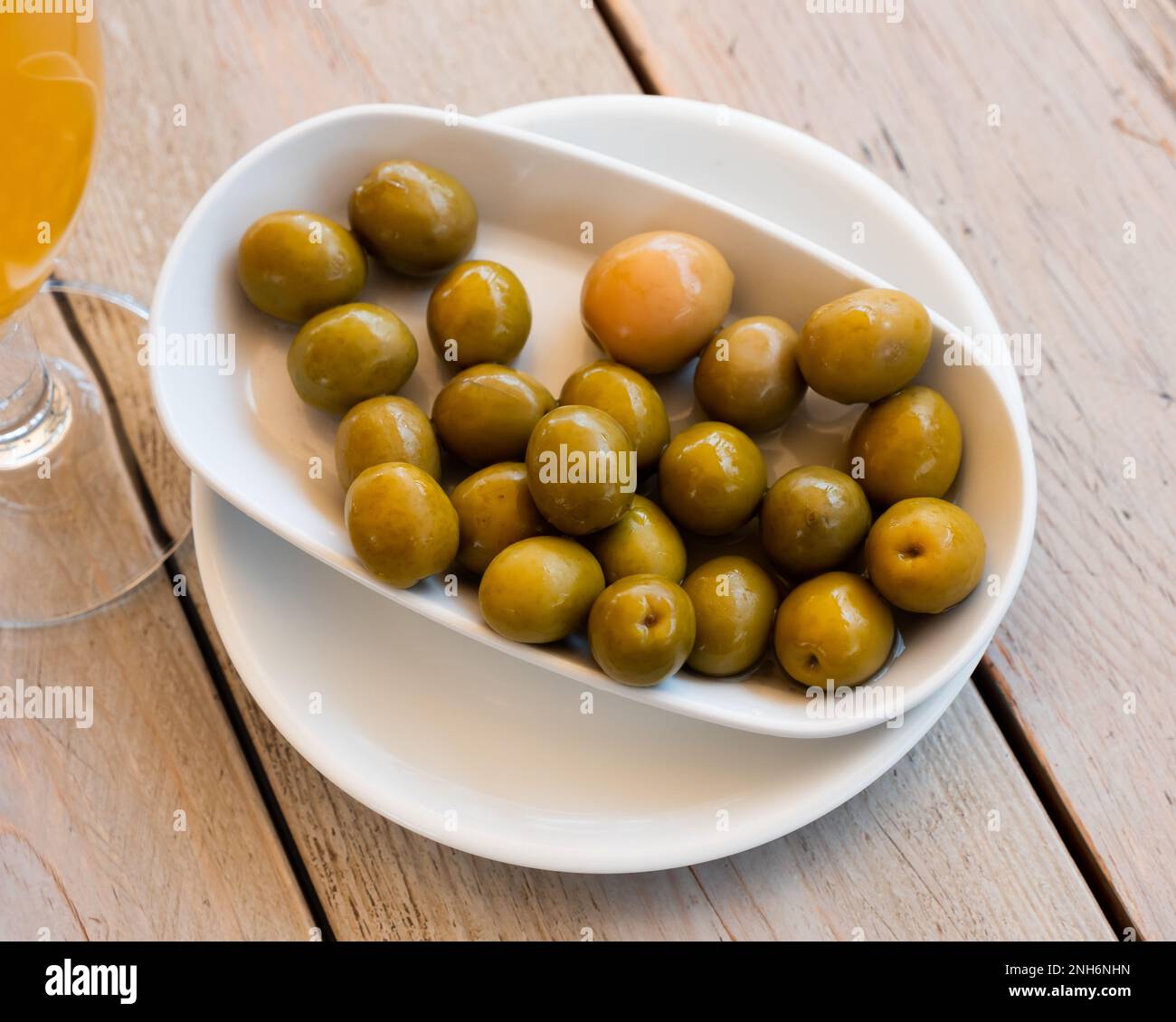 Pickled green olives with a stone Stock Photo Alamy