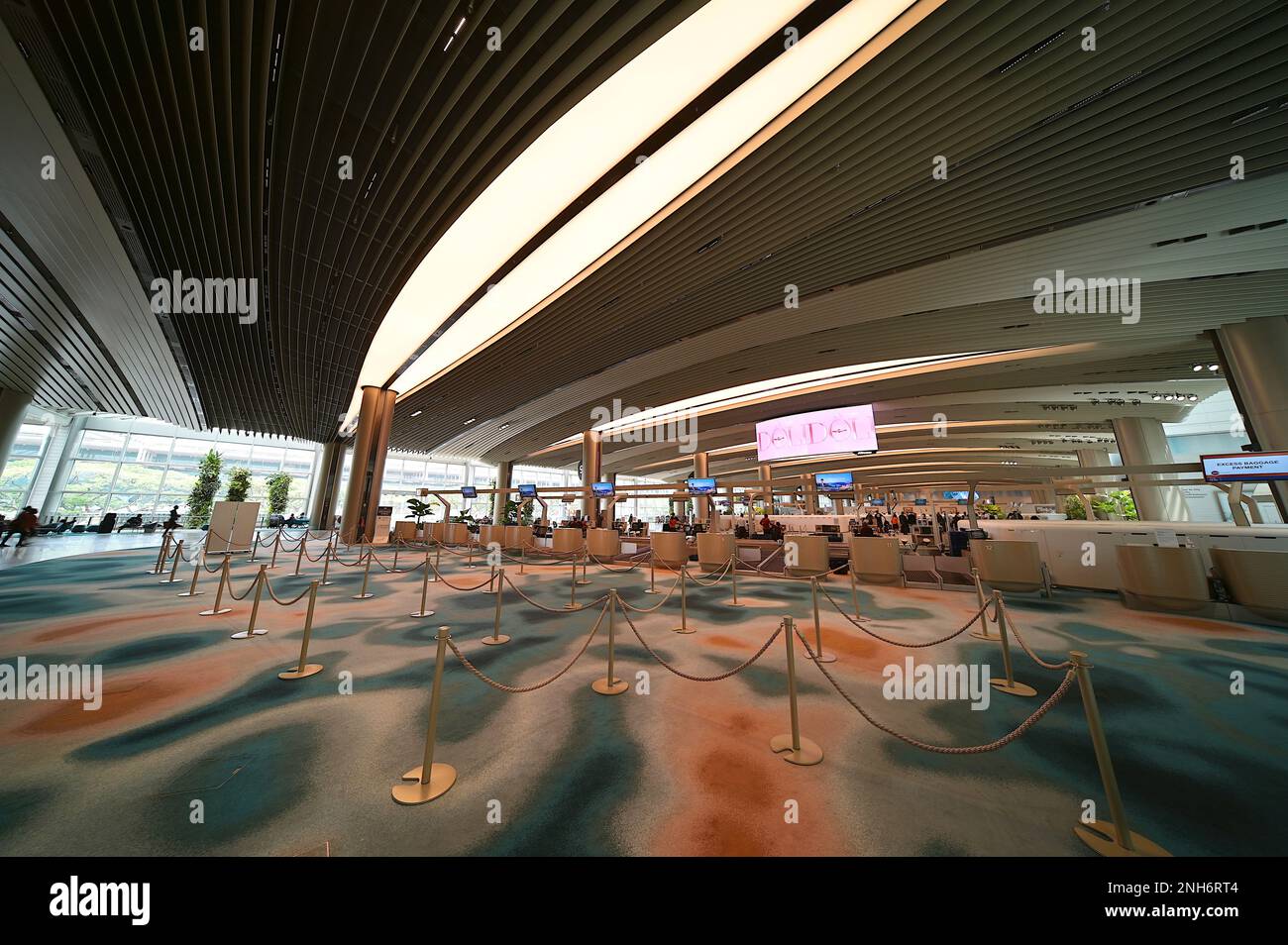Refurbished check-in counters at departure hall Terminal 2, Singapore Changi Airport, February 2023 Stock Photo