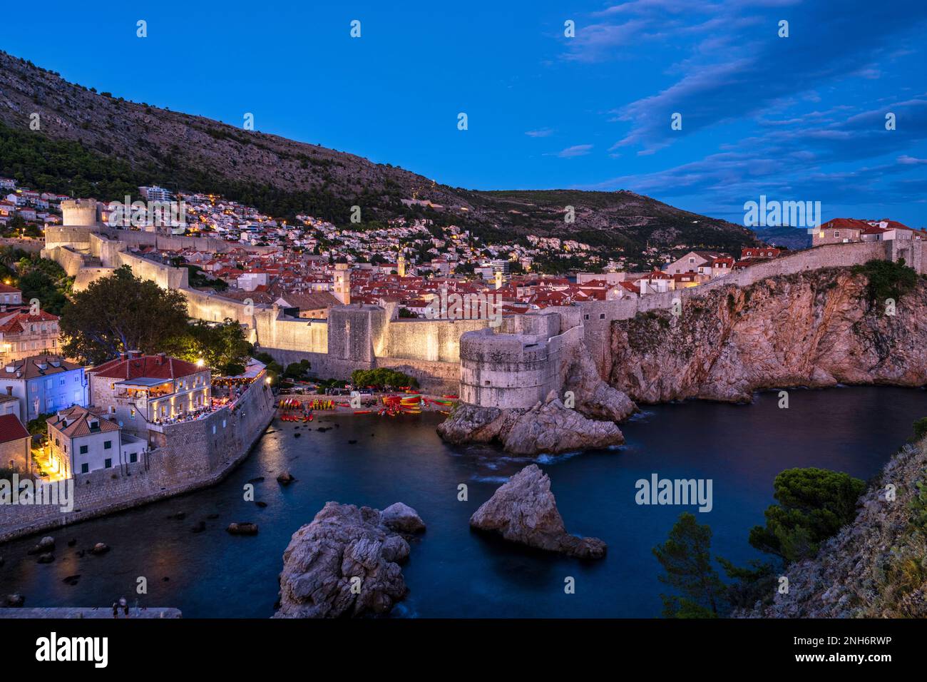 View of the old walled town of Dubrovnik at dusk from Fort Lovrijenac (St Lawrence Fortress) outside the western wall of Dubrovnik in Croatia Stock Photo