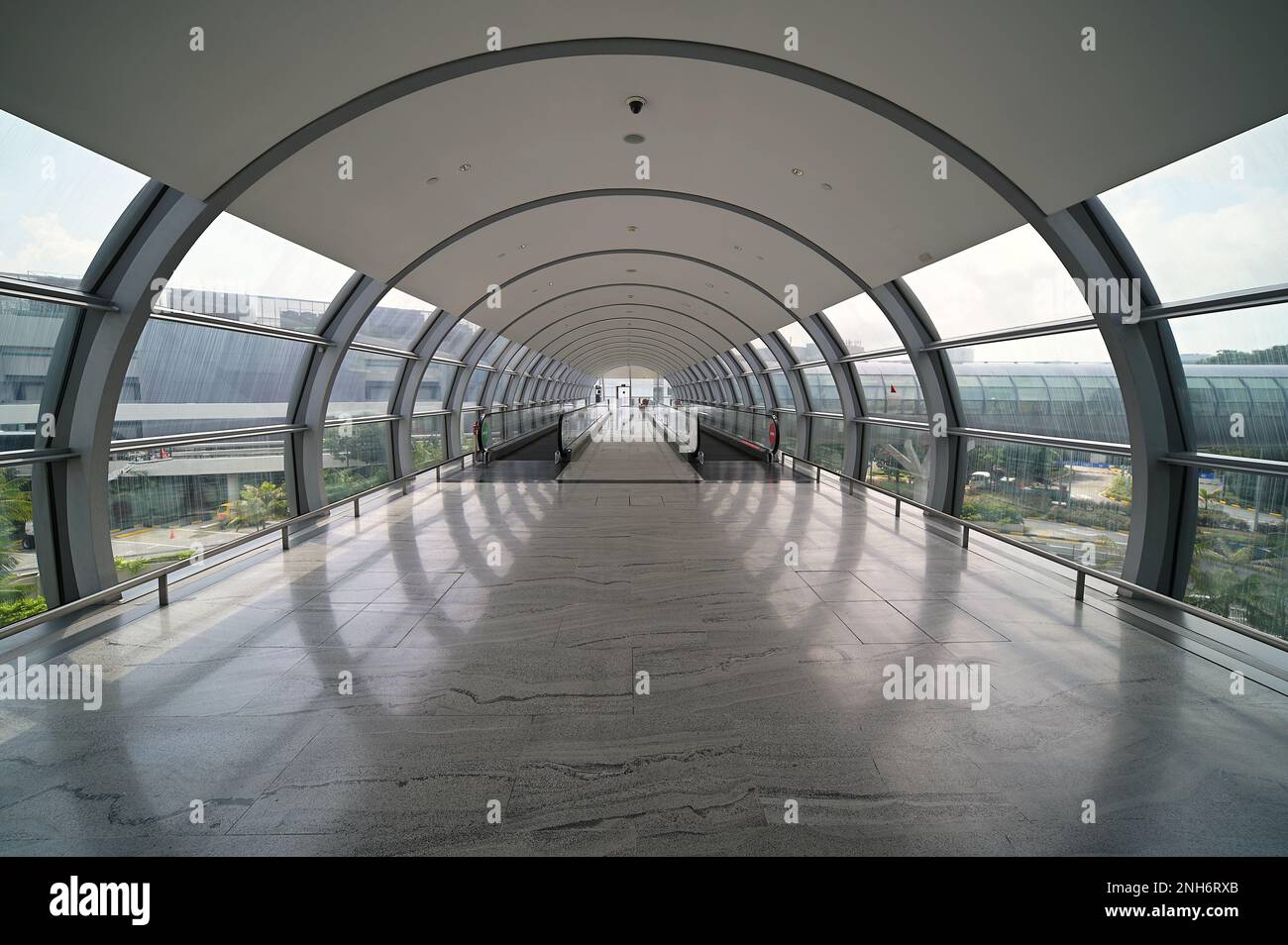 Link bridge with travelators between Terminal 1 and Jewel Changi Airport, Singapore, February 2023 Stock Photo