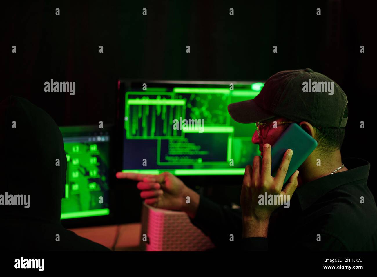 Cyber criminals calling client when planning ddos attack Stock Photo