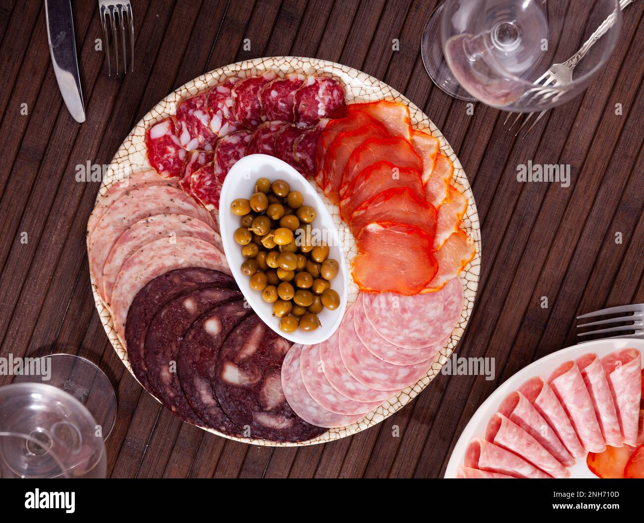 Spanish antipasto with assorted meat and olives Stock Photo Alamy