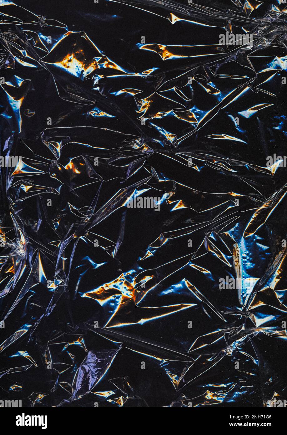 Wrinkled film. Worn texture. Aged plastic wrap. Blue orange defect dust