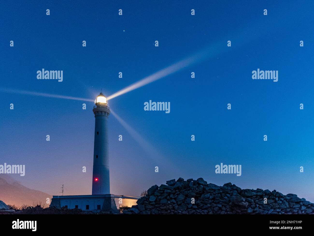 The lighthouse of San Vito lo Capo at dusk, Sicily Stock Photo