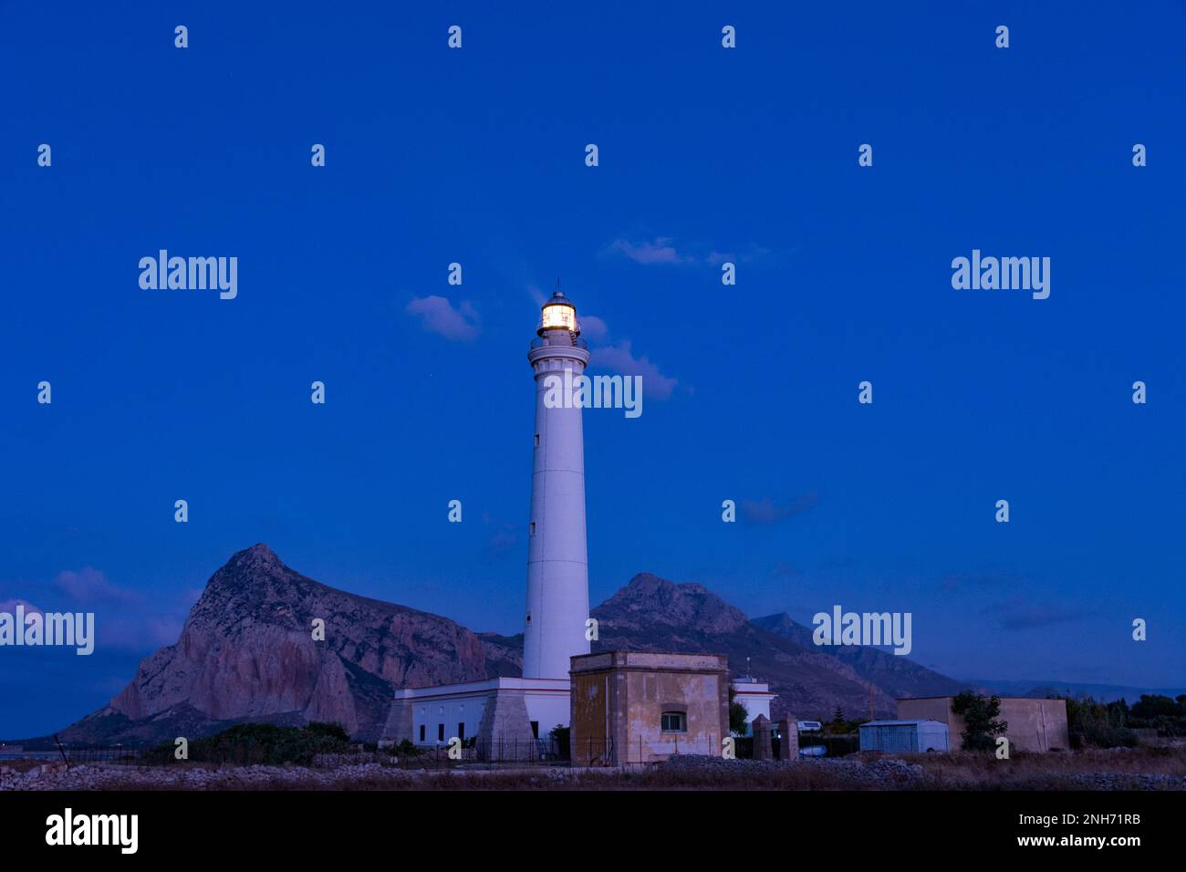 The lighthouse of San Vito lo Capo at dusk, Sicily Stock Photo