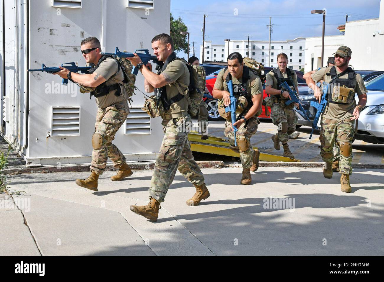 Country artist Drake White, right, advances to a simulated battlefield causality lane along with Soldiers attending the U.S. Army Medical Center of Excellence Command Tactical Combat Medical Care course at Fort Sam Houston, Texas, July 20, 2022. The course teaches Soldiers a wide variety of areas within a five-day timeframe to include trauma and wound care. White visited the post to film an upcoming docuseries called Inside the Base, which follows leading country artists as they tour U.S. military bases across the nation. Stock Photo