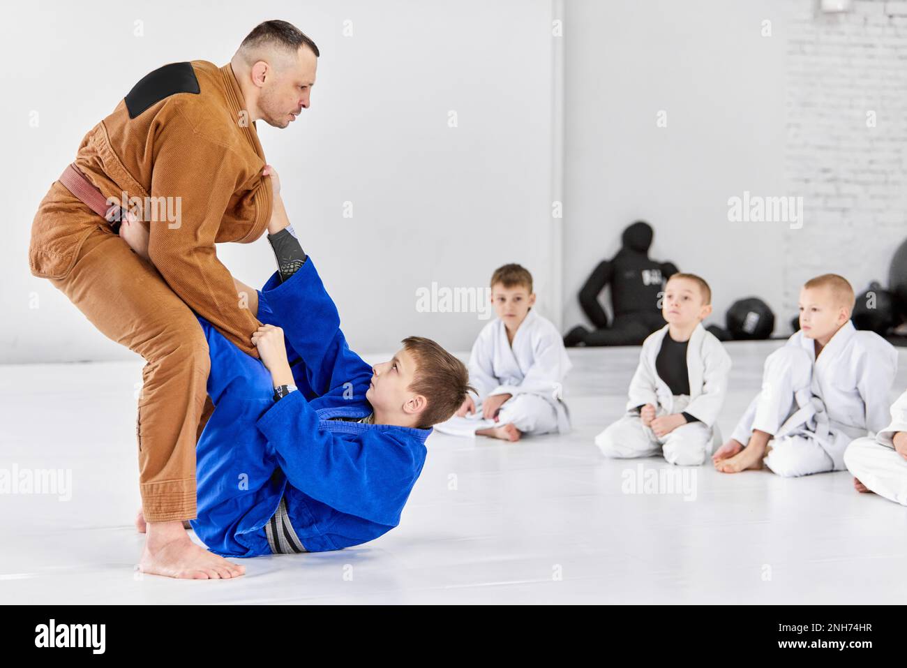 Teacher, professional judo, jiu jitsu coach training kinds, boys