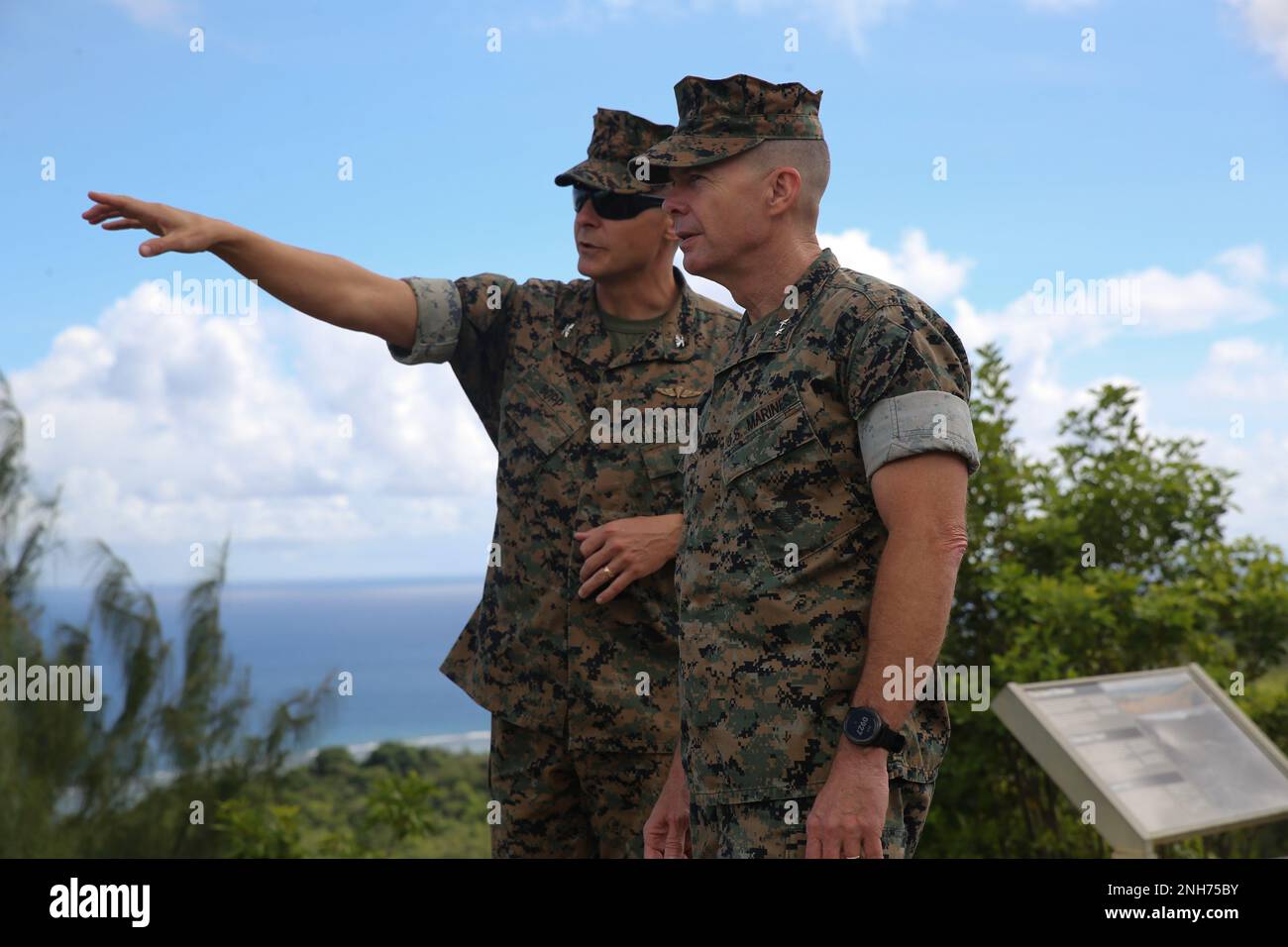 U.S. Marine Corps Col. Christopher L. Bopp, commanding officer for Marine Corps Base (MCB) Camp Blaz, left, talks to Maj. Gen. Jay M. Bargeron, commanding general for 3rd Marine Division, right, during a visit to Guam, July 20, 2022. MCB Camp Blaz is currently under construction and will allow the Marine Corps to maintain a forward presence in the Indo-Pacific region. Stock Photo