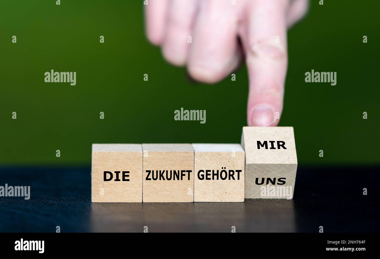 Wooden cubes form the German phrase 'die Zukunft gehoert uns' (it is our future) and 'die Zukunft gehoert mir' (it is my future). Stock Photo