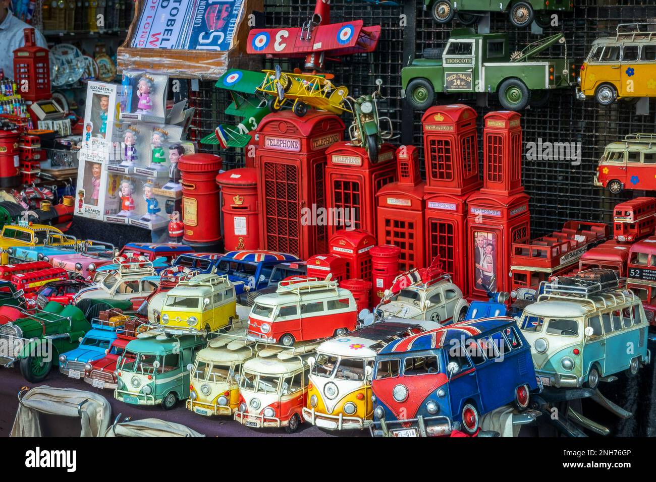 British souvenirs toys and objects with phone booths, vintage mini bus and cars at Portobello market in London, UK Stock Photo