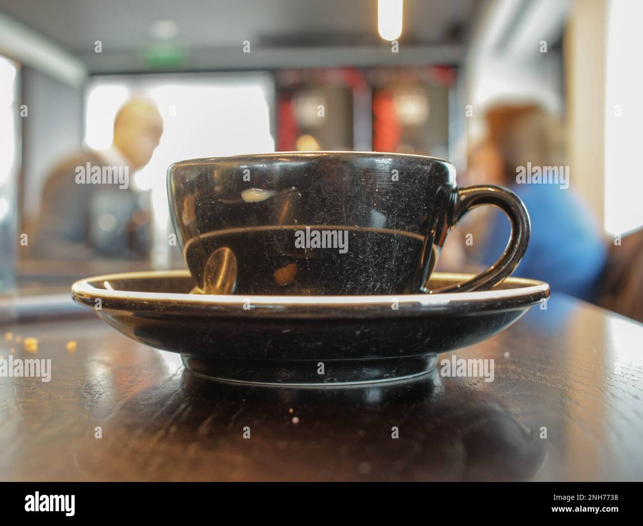 having a cup of coffee in a cafeteria in Viveiro Stock Photo