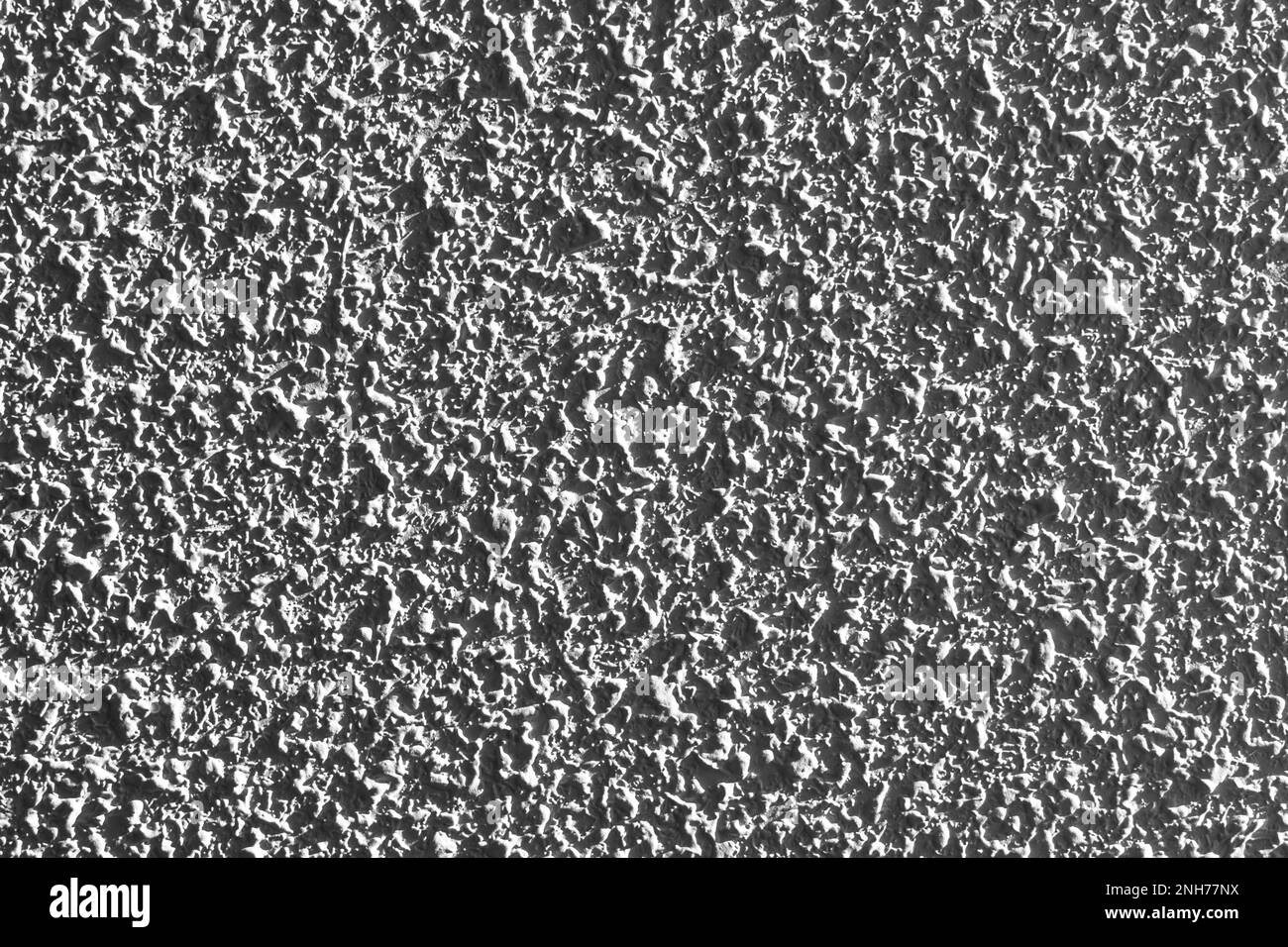 Cement wall with a rough mottled gray surface closeup Stock Photo