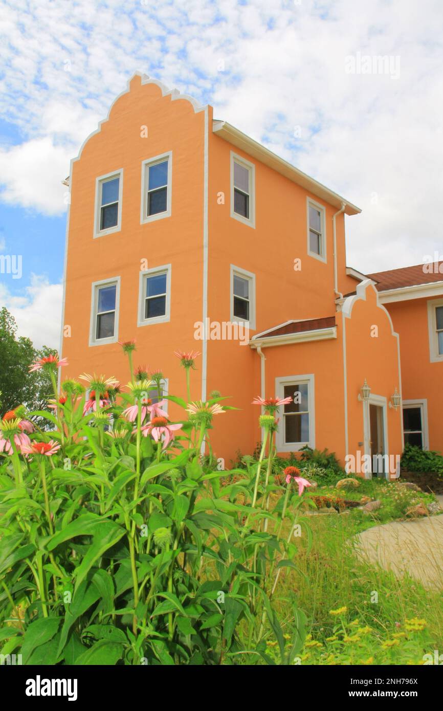 MonteBello Bed & Breakfast Inn in the morning with pink cornflowers in