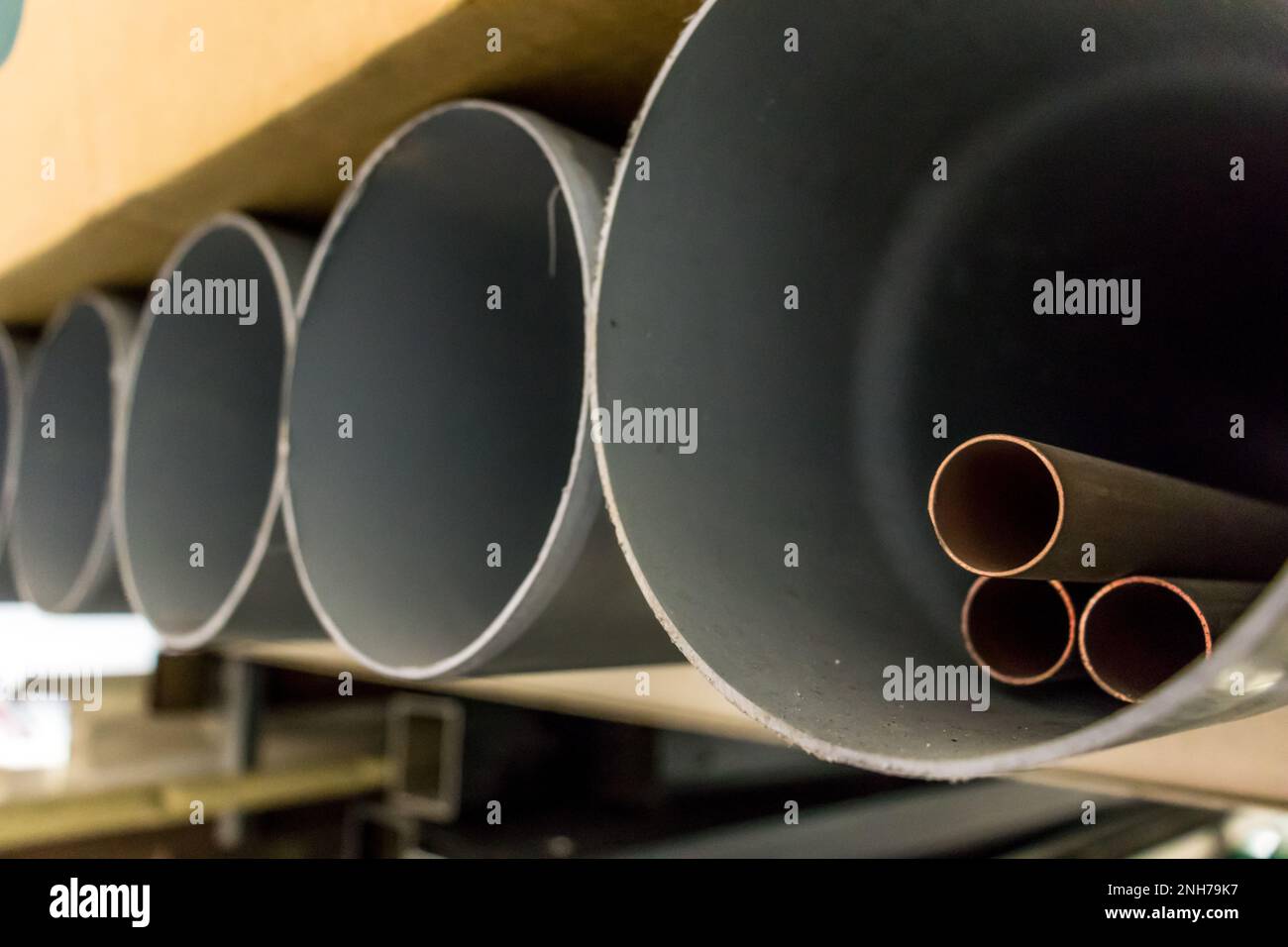 Plastic and copper plumbing pipes, on a shelf Stock Photo Alamy
