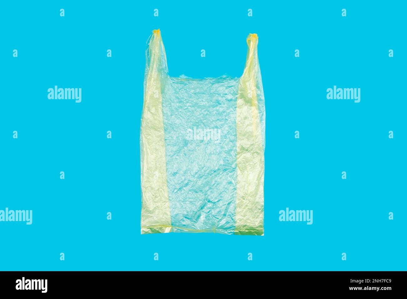 Yellow Singleuse Plastic Shopping Bag on Blue Background. This kinD of