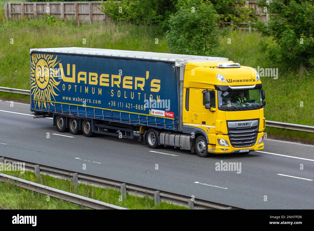 Waberers (Waberer's International Nyrt) Optimum Solution. Hungary foreign Lorries, DAF XF travelling on the M6 at Lancaster, UK Stock Photo