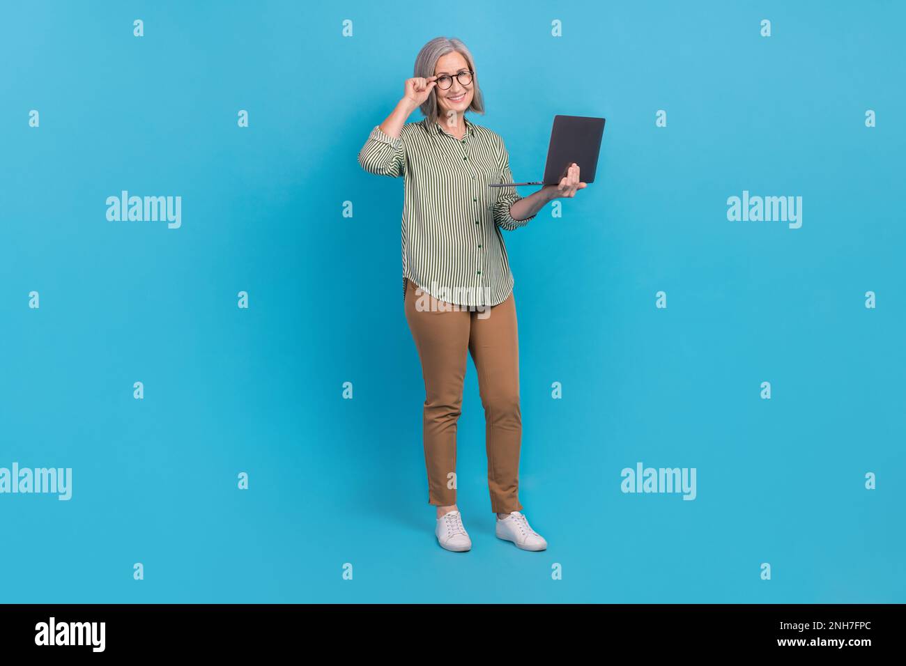 Full length size cadre of business lady project manager hold her apple  netbook touch glasses check program code isolated on blue color background  Stock Photo - Alamy